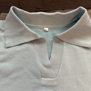 Light blue short sleeve women’s sweater. Brand new. Size Large.